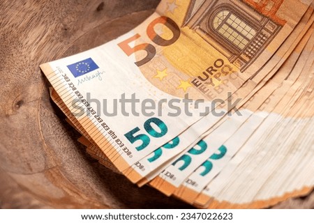 Euro banknotes in vintage wooden container. Concept saving money Royalty-Free Stock Photo #2347022623