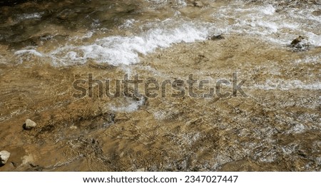 clear water in a mountain river, background
