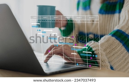 Human use laptop with calendar schedule time plan appointment, data management system, checking organizes day, week, month project list, business, calendar appointment plan concept Royalty-Free Stock Photo #2347037493