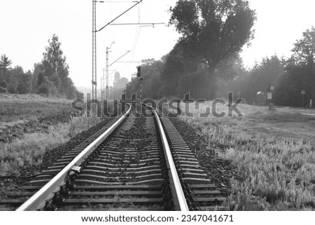 Railway tracks at sunrise. Black and white photos. Lublin Poland. Railroad tracks under the rising sun.