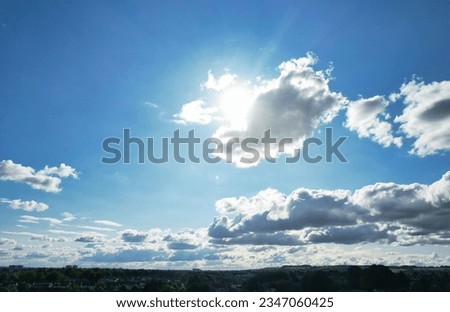Low Angle Camera Footage of Dramatic Clouds and Blue Sky over The Luton City of England UK. August 6th, 2023 Royalty-Free Stock Photo #2347060425