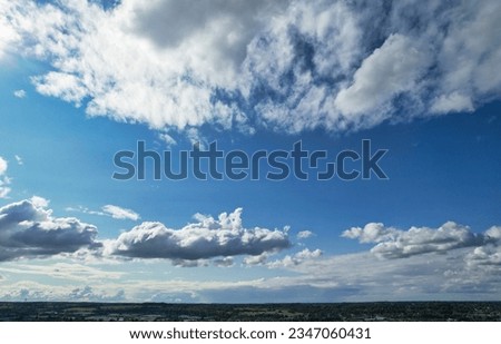Low Angle Camera Footage of Dramatic Clouds and Blue Sky over The Luton City of England UK. August 6th, 2023 Royalty-Free Stock Photo #2347060431