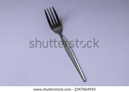 Silver fork on a white background. Top view. Flat lay.