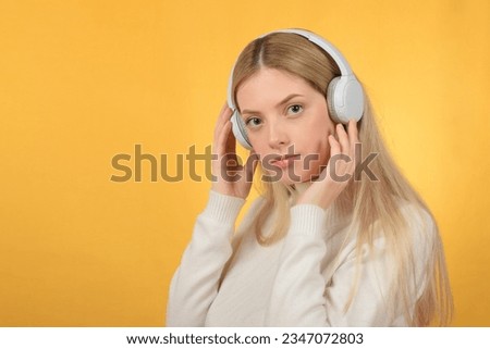 cute pretty woman with headphones on her head