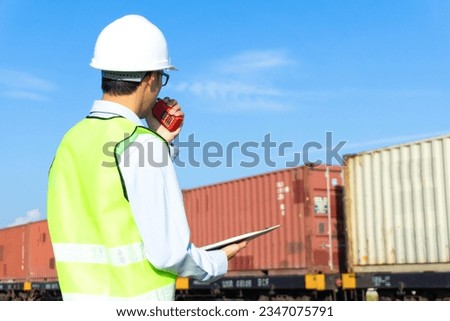 Engineer controlling freight by train
