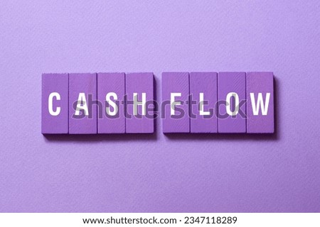 Cash flow - word concept on building blocks, text, letters