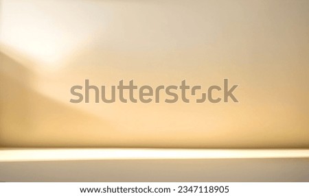 Minimalistic abstract light beige golden background for product presentation. Incident light from the window on the wall and floor. Royalty-Free Stock Photo #2347118905