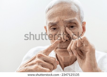 Old elderly suffering Chronic Rhinosinusitis with Nasal Polyps or Sinusitis,cold or sinus infections,nasal congestion,blockage of nose,difficult to breathe through nostrils and reduced sense of smell Royalty-Free Stock Photo #2347125135