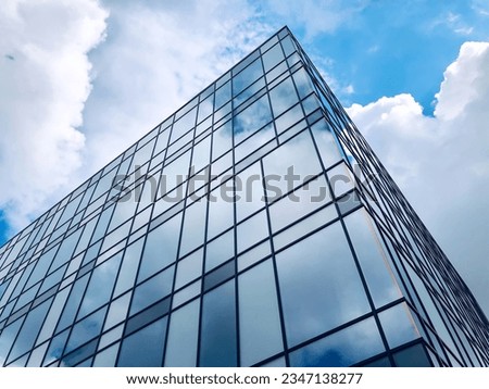 Urban building design concept, bottom view of modern skyscraper in business district. Buildings glass window, downtown area. Royalty-Free Stock Photo #2347138277