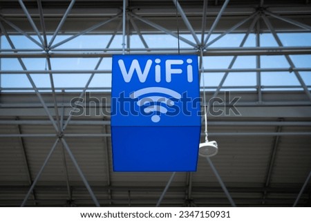 Free wi-fi station in a public place. Free Wi-Fi sign at the airport or other public place to connect. Royalty-Free Stock Photo #2347150931