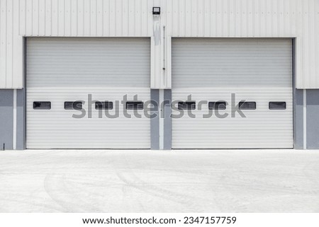 Roll up gates of the huge warehouse (hangar)
