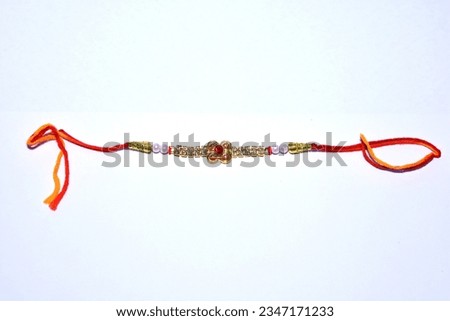 Indian festival: Raksha Bandhan background with an elegant Rakhi. A traditional Indian wrist band which is a symbol of love between Brothers and Sisters