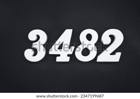 Black for the background. The number 3482 is made of white painted wood.