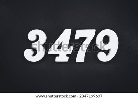 Black for the background. The number 3479 is made of white painted wood.