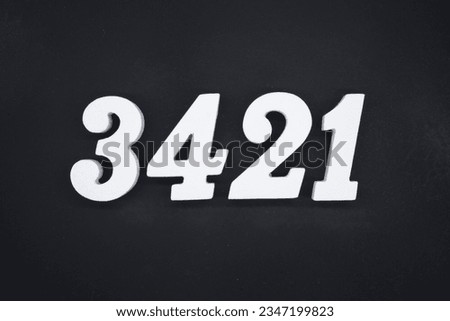 Black for the background. The number 3421 is made of white painted wood.
