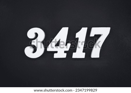 Black for the background. The number 3417 is made of white painted wood.