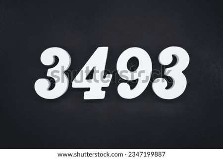Black for the background. The number 3493 is made of white painted wood.