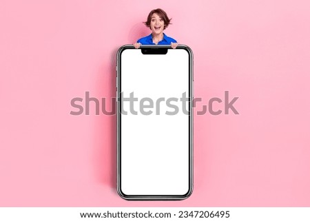 Full body length cadre photo of excited surprised reaction lady hold huge smartphone menu display electronic panel isolated on pink color background