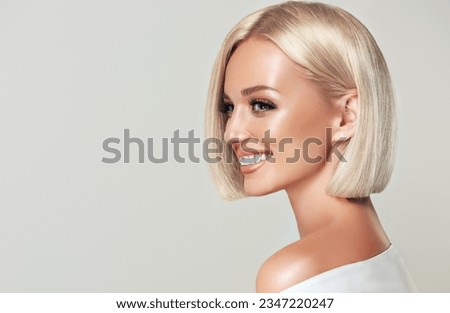 Beautiful model girl with short straight hair .Beauty woman with blonde Bob   hairstyle  .Fashion, cosmetics and makeup Royalty-Free Stock Photo #2347220247