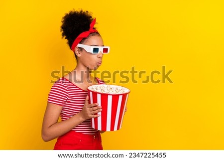 Photo of scared shocked lady wear striped red t-shirt watching vr film empty space isolated yellow color background