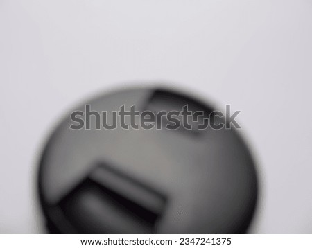 a photo of the camera lens cap out of focus

