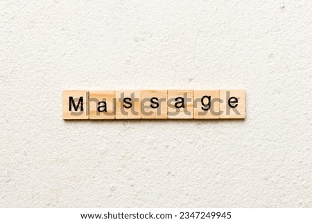 massage word written on wood block. massage text on cement table for your desing, concept.