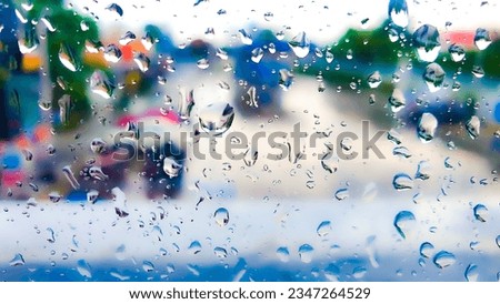 Glass with brightmirror with bright water droplets clinging to the distance in a variety of beautiful colors. for the background illustration