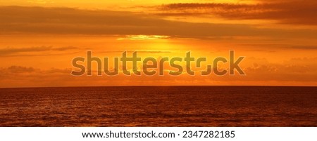 Fantastic view of the dark overcast sky. Dramatic and picturesque evening sunset scene over Black sea. Storm clouds, storm passing over sea, dramatic clouds after storm at sunset.