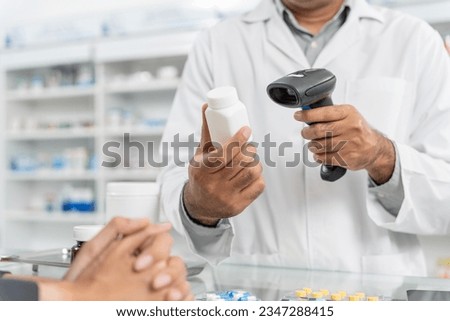Close up hands of male pharmacist using barcode scanner for selling medicine to patient customer in the pharmacy drugstore, hand over capsule pills of medicine from hand to another hand charge. Royalty-Free Stock Photo #2347288415