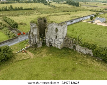 Aerial view of Ballintober, Ballintubber castle in Roscommon county, square shape courtyard surrounded by walls with circular towers at the corners in Ireland