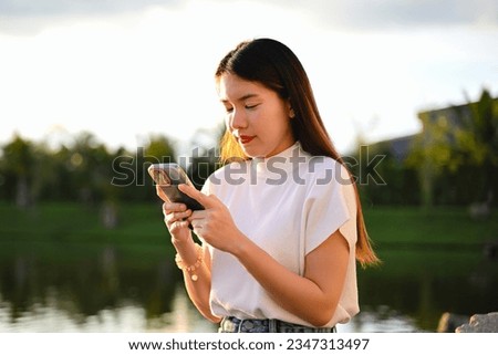 A woman is using a smart phone for various daily activities. The photo is of high quality.