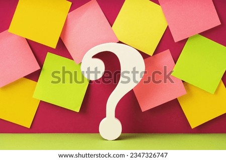 White question mark symbol against many mockup notes background. QandA FAQ. Questions and answers. How to and why concept