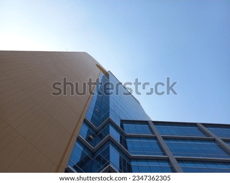 Tall buildings and clear sky seen from below