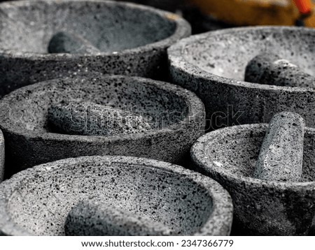 Molcajetes made of volcanic stone, for sale in a street market in Mexico Royalty-Free Stock Photo #2347366779