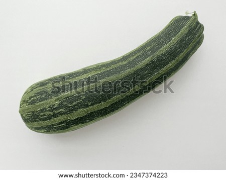 Fresh green Zucchini on white background. Photo squash