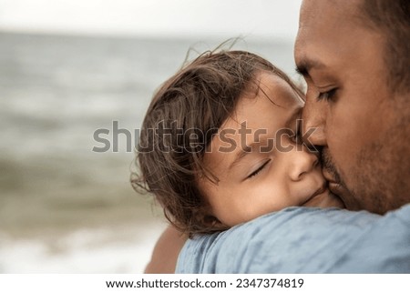 Closeup portrait of father kissing his little daughter, happy family and parenthood concept - Image