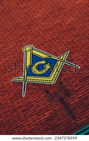 Masonic symbol on a brick background