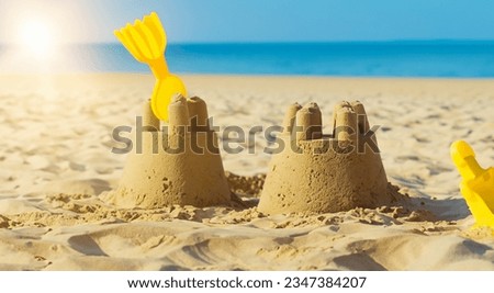 beautiful sandcastle on a beautiful beach with the sun in the background in high resolution and sharpness HD