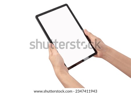Female hand holding tablet showing white screen