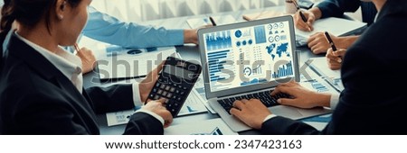 Business intelligence and data analysis concept. Analyst team working on financial data analysis dashboard on laptop screen as marketing indication for effective business strategic planning. Insight