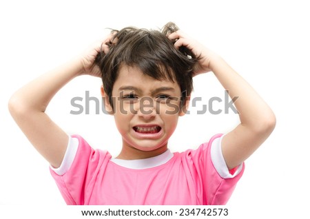 Little boy itchy his hair on white background
