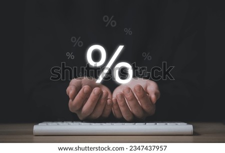 Businessman hand holding magnifying glass showing percentage sign business investment concept, increase stock profit, finance, marketing, sale, interest rate Better economy and discounts
