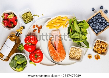Variety of fresh, whole unprocessed food; healthy nutrition, anti-inflammatory diet products, top view Royalty-Free Stock Photo #2347473069