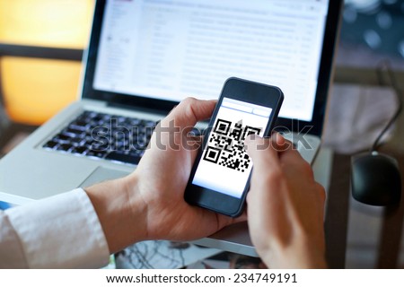 smart phone with qr code on the screen Royalty-Free Stock Photo #234749191