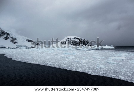 Berg bits; Antarctic Peninsula; Brash ice lane; Edge of brash ice; Sculpted berg, brushed ice; Ship's wake, through brash ice; Sunset clouds, over brash iced; Antarctic Peninsula; Blue Bay