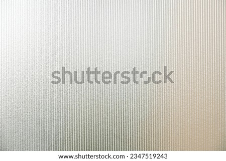 clear glass background and texture. Transparent material Corrugated glass surface use for partition wall, door or roofing. close up photo.