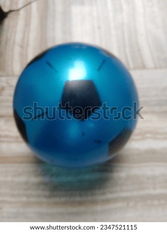 Blue and black football inside the room