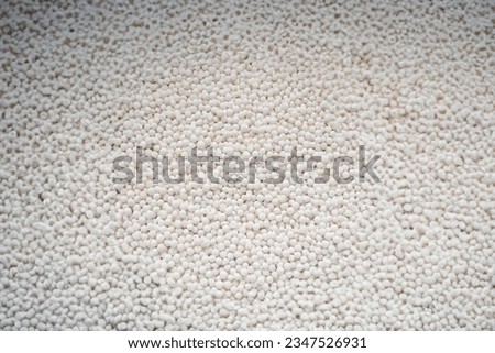 White background made of tiny tapioca balls. Preparing a sweet dessert in the kitchen Royalty-Free Stock Photo #2347526931