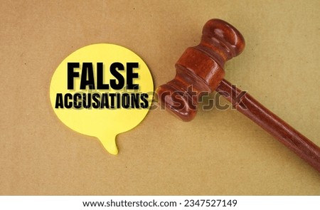 judge's hammer and chat box with the word false accusation. the concept of unjustified accusations or false accusations Royalty-Free Stock Photo #2347527149