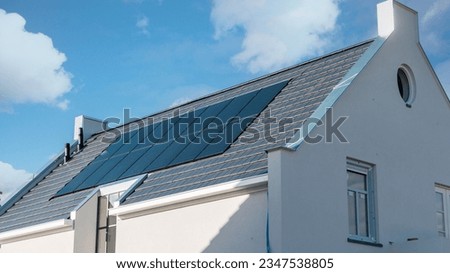 Newly build houses with solar panels attached on the roof , Solar system on a roof Own home Royalty-Free Stock Photo #2347538805